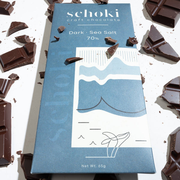 Schoki Chocolate, Dark Sea Salt 70%. Blue packaging with chocolate bar. Ethical bean to bar chocolate handcrafted in Squamish, B.C.